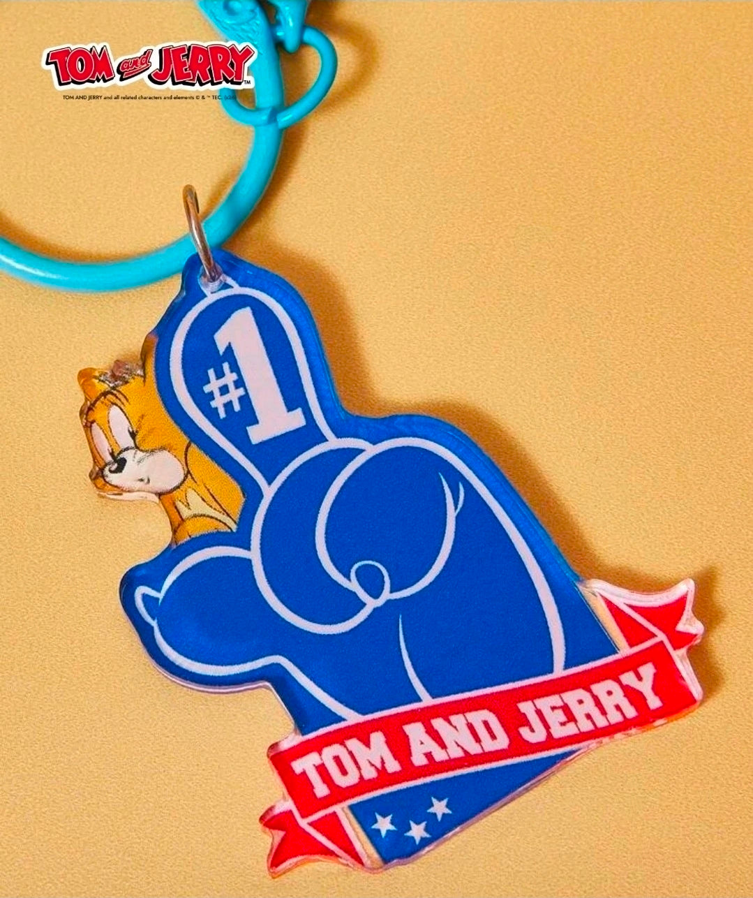 Blue patriotic baseball keychain with #1 emblem and metal bell; Tom & Jerry character