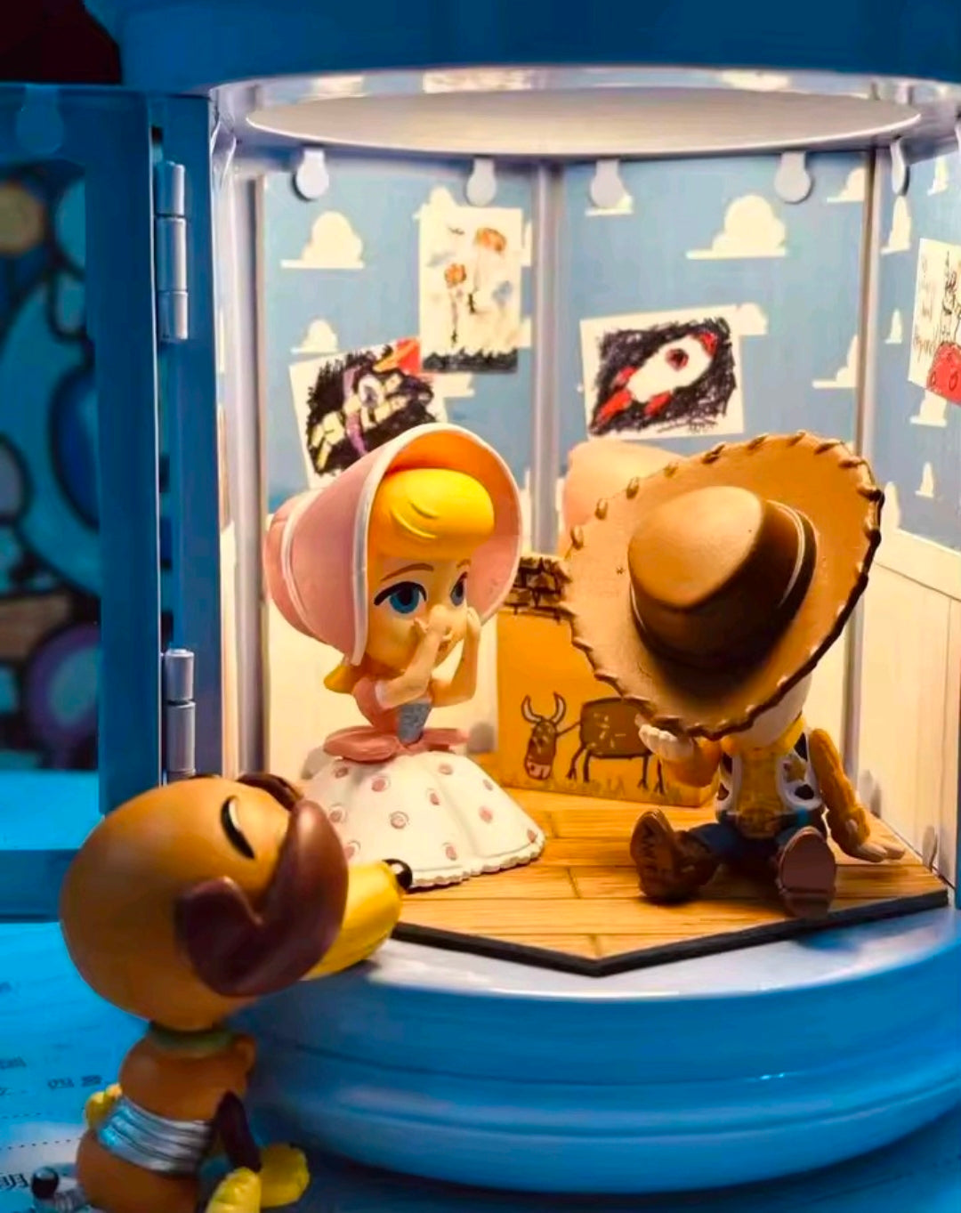 Toy Story gashapon figures inside a clear round capsule display