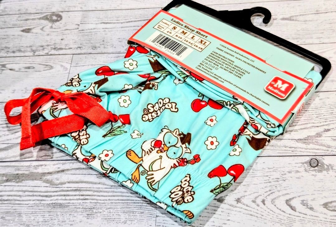 Mint cartoon-print sleep shorts, folded with size Medium packaging tag