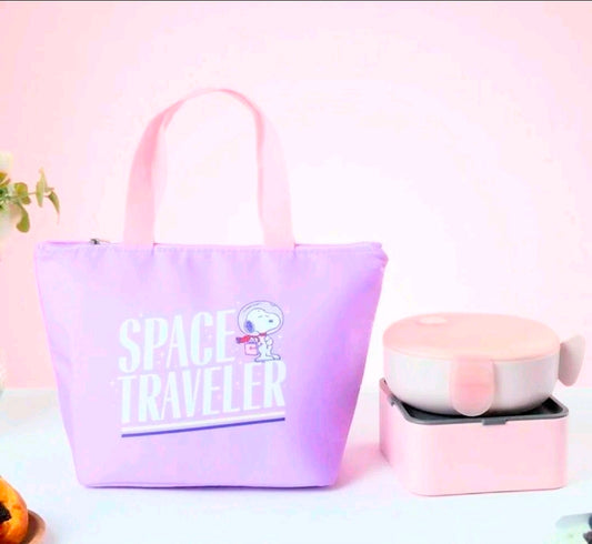 Purple insulated lunch bag tote with pink handles and “Space Traveler” Snoopy graphic