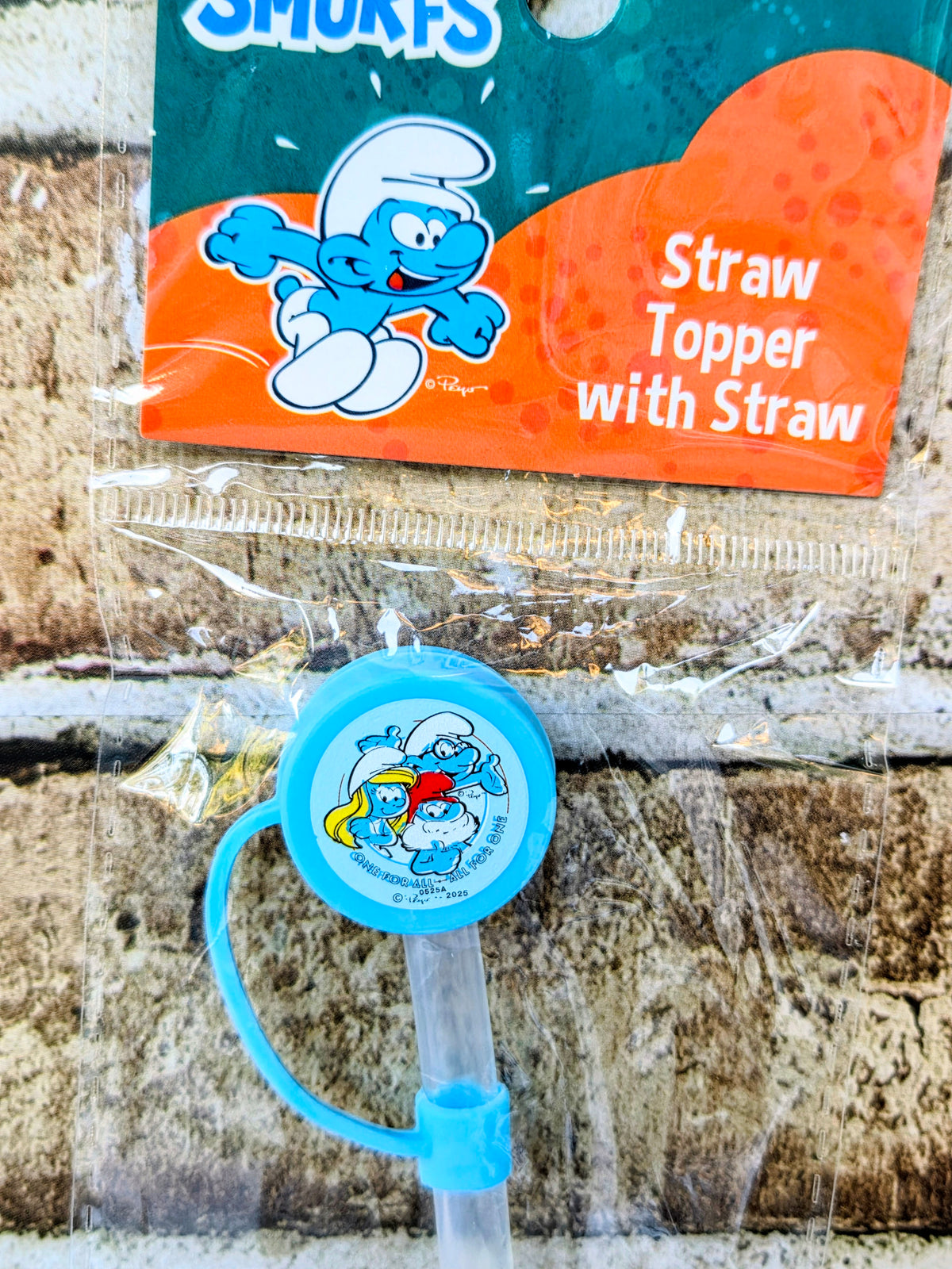 Smurfs straw topper with straw, orange label and blue cap