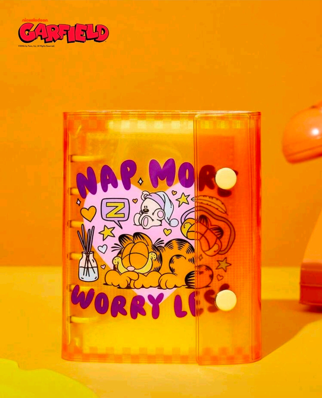 A7 sticker photo album planner with translucent orange cover and cartoon "NAP..MOR" sticker text