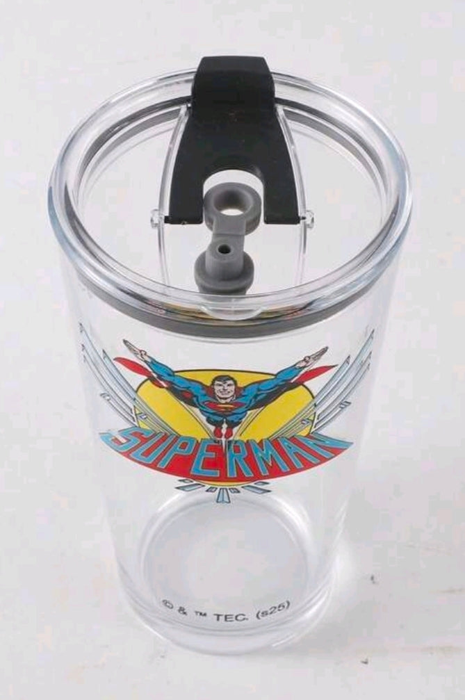 Clear tumbler with black sip lid and Superman front graphic.