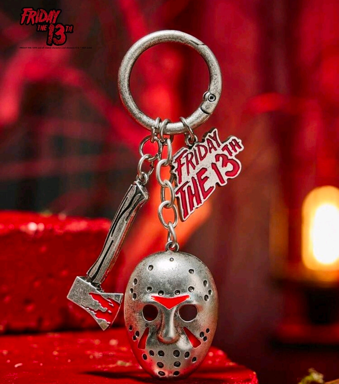Metal ring keychain with axe charm and hockey mask pendant with red details