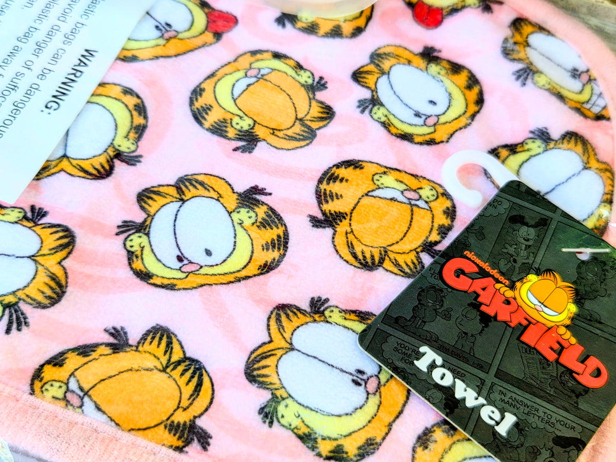 Pink Garfield snack bag fabric with repeating cat face pattern