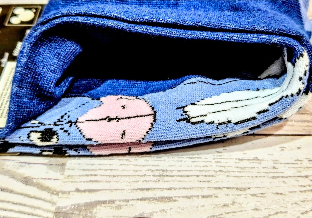 Blue crew socks with Eeyore cartoon graphic on ankle and foot