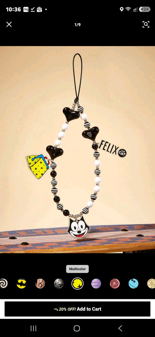 Black and white beaded phone charm lanyard with Felix face charm and yellow accessory heart