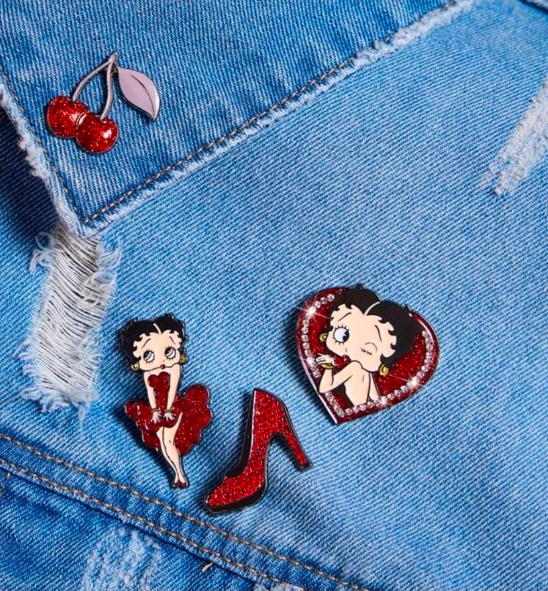 Denim jacket with Betty Boop red dress pin and red high heel enamel pin