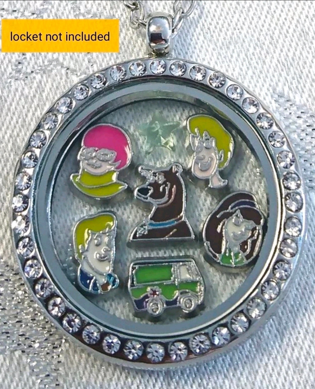Round floating charm locket with rhinestone border and character scene inside