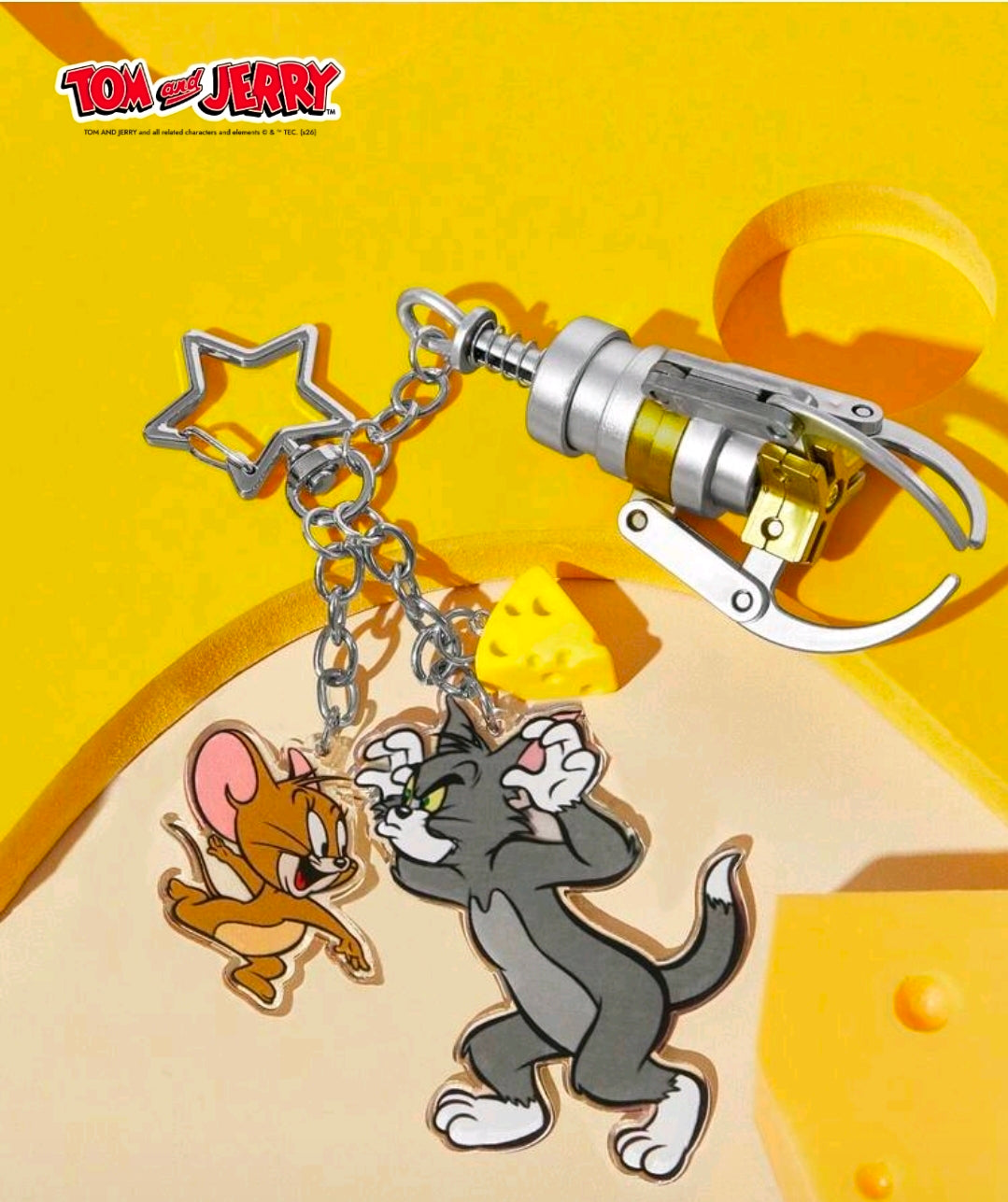 Tom & Jerry acrylic grabber claw keychain with star topper, chains, and claw detail