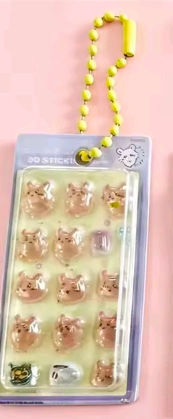 Mini gashapon sticker keychain with 3D character stickers and yellow bead strap