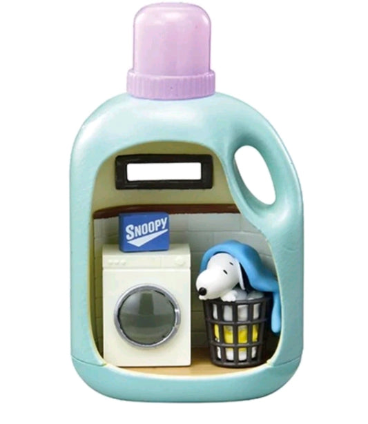 Light blue laundry detergent figure with purple cap, Snoopy in a small basket