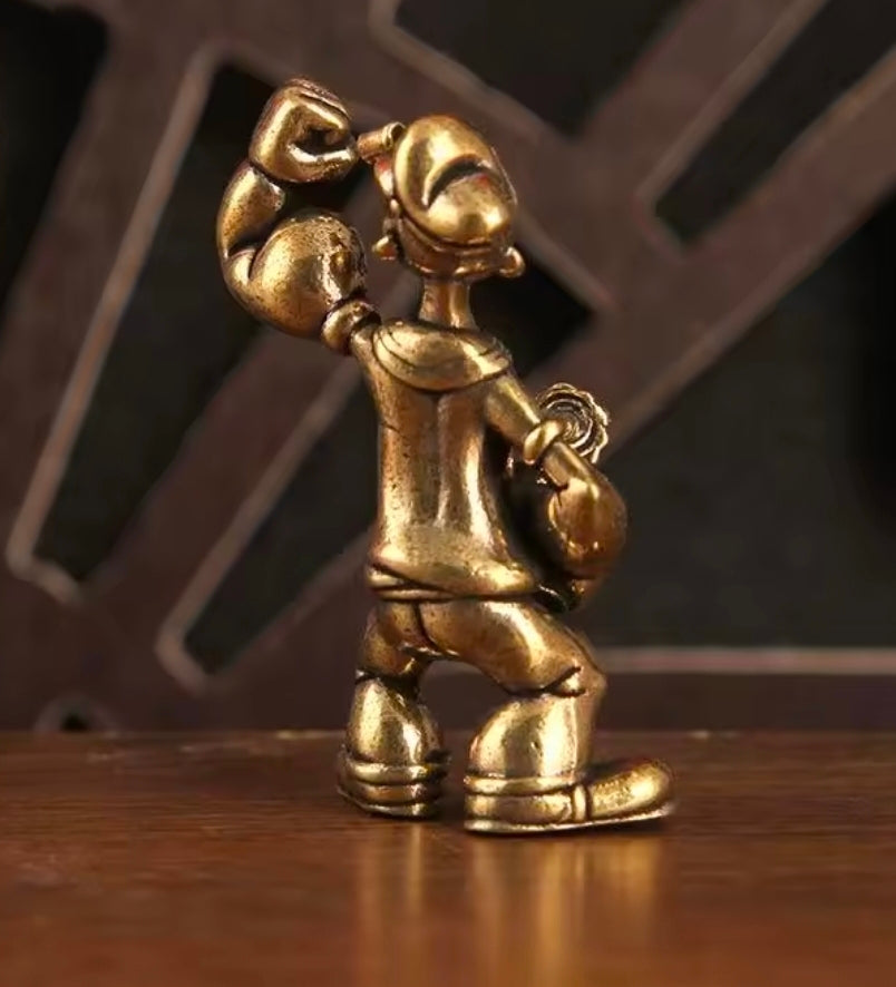 Brass sailor mini statue figure angled side view, clenched fists and detailed belt buckle