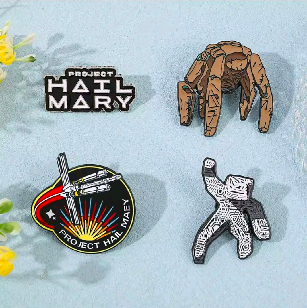 4-piece enamel pin set arranged flat: character pins, a text logo pin, and round ship badge