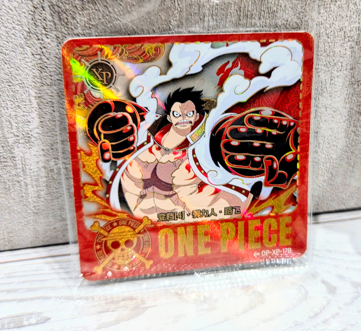Mini figure blister pack featuring a cartoon fighter with red boxing gloves and “ONE PIECE” art.