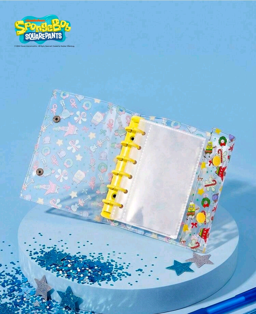 Opened SpongeBob SquarePants 6-ring photo album with yellow rings and clear page sleeves