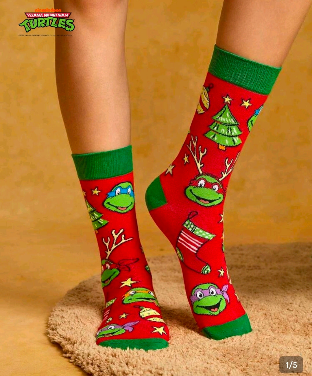 Red crew socks with green cuffs and cartoon turtle Christmas design on legs