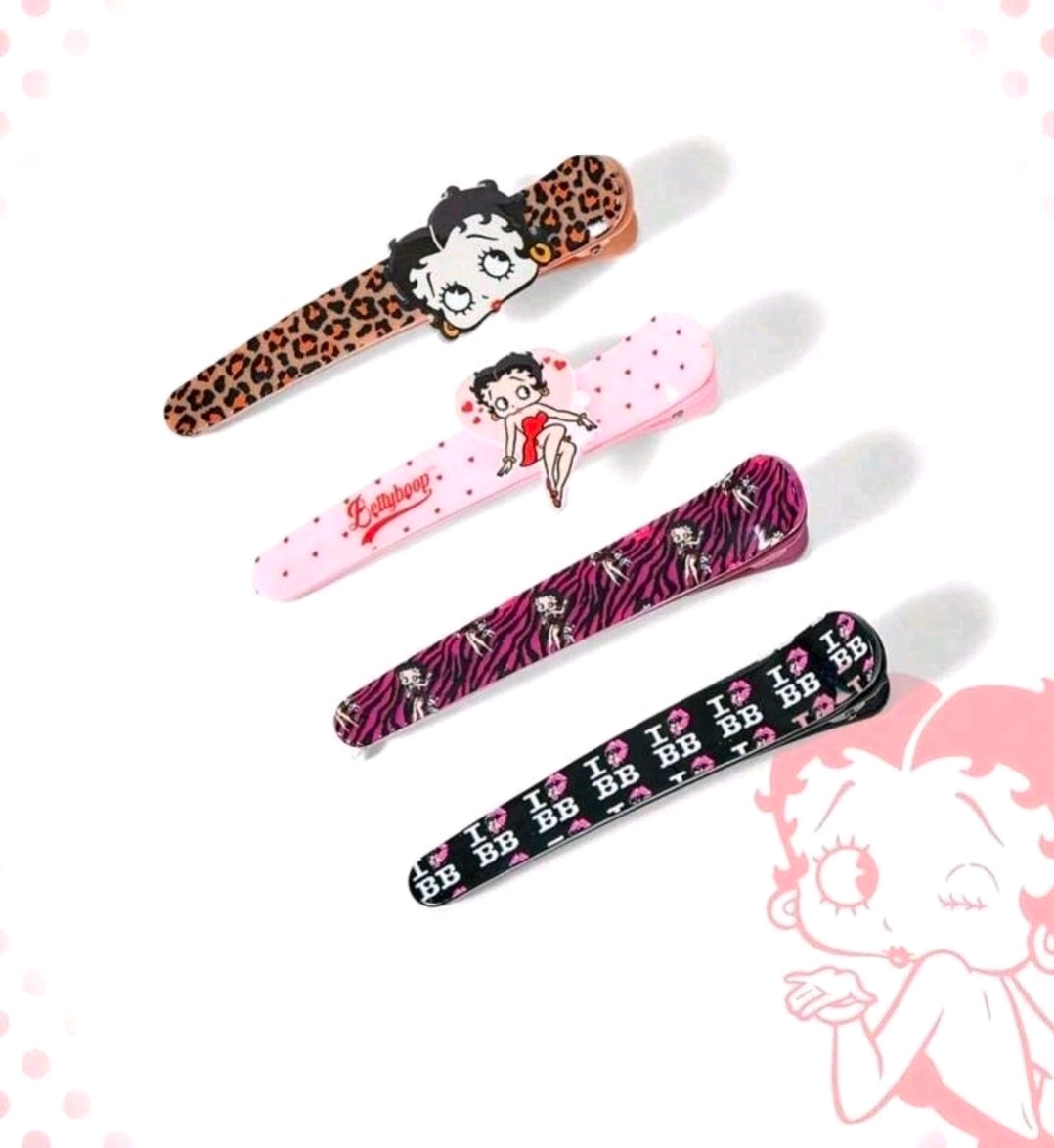 Assorted character hair clips in leopard, pink, zebra, and black striped designs