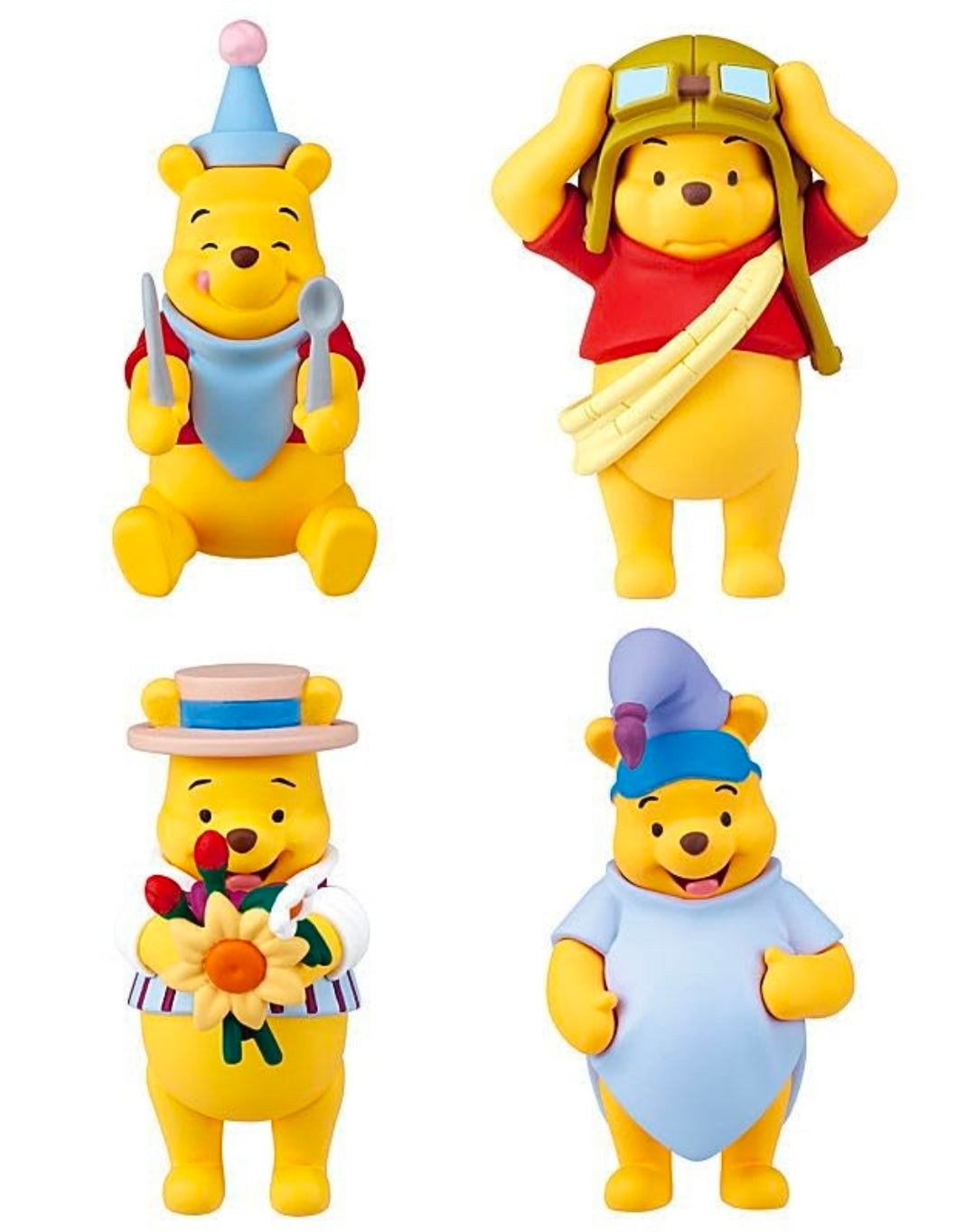 Set of four Winnie the Pooh character figures in different costumes, full-body view