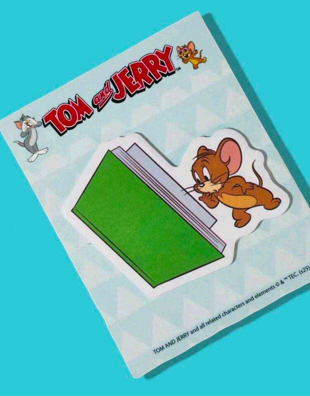 Tom and Jerry sticky note pad showing green die-cut note stack with character logo