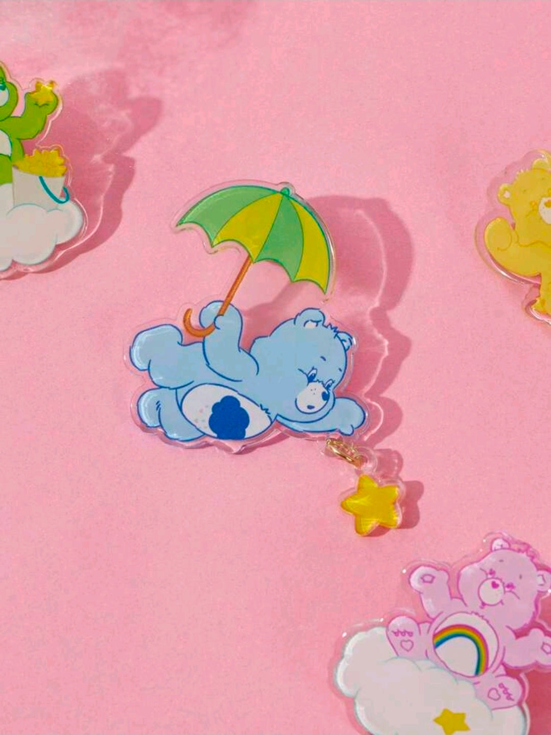 Acrylic cascading bear brooch pin with blue bear on a cloud and star charm