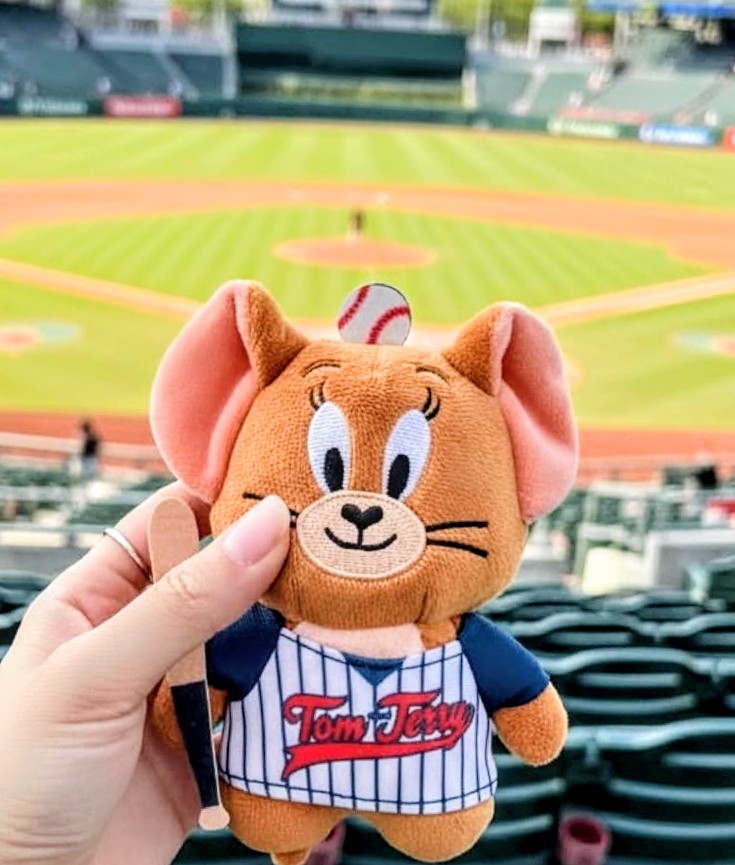 Orange Tom & Jerry mouse plush keychain, blue-and-white pinstripe baseball jersey