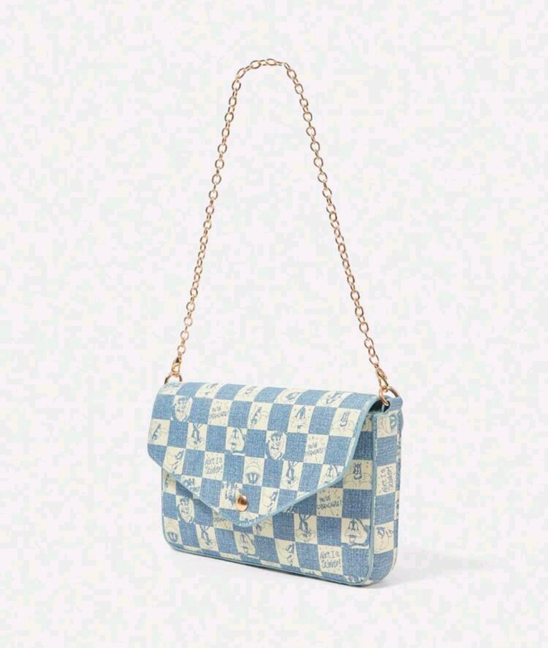 Denim blue check-pattern crossbody bag with gold chain strap and flap.