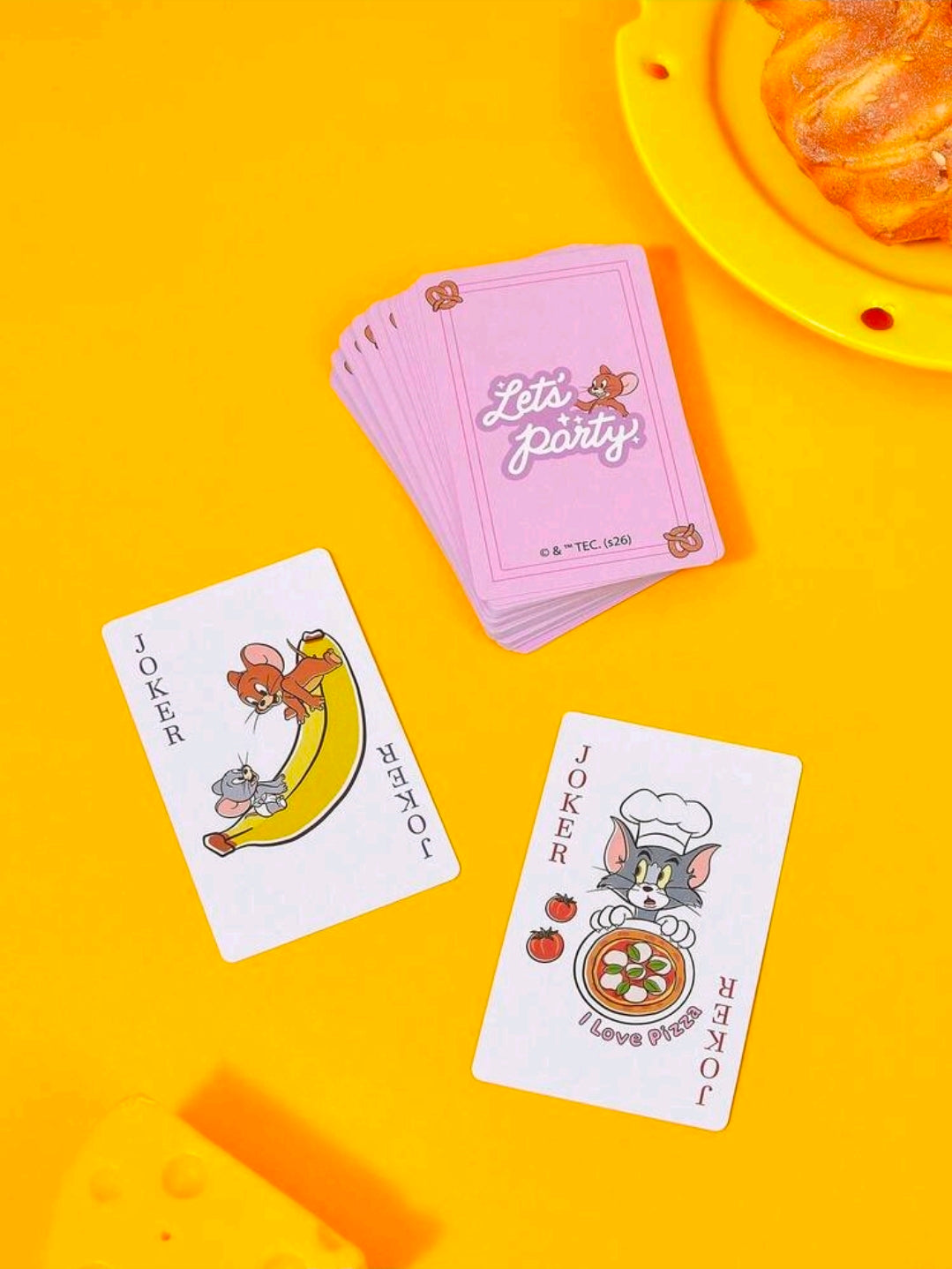 Tom & Jerry playing card deck with face cards showing characters, pizza and joker art