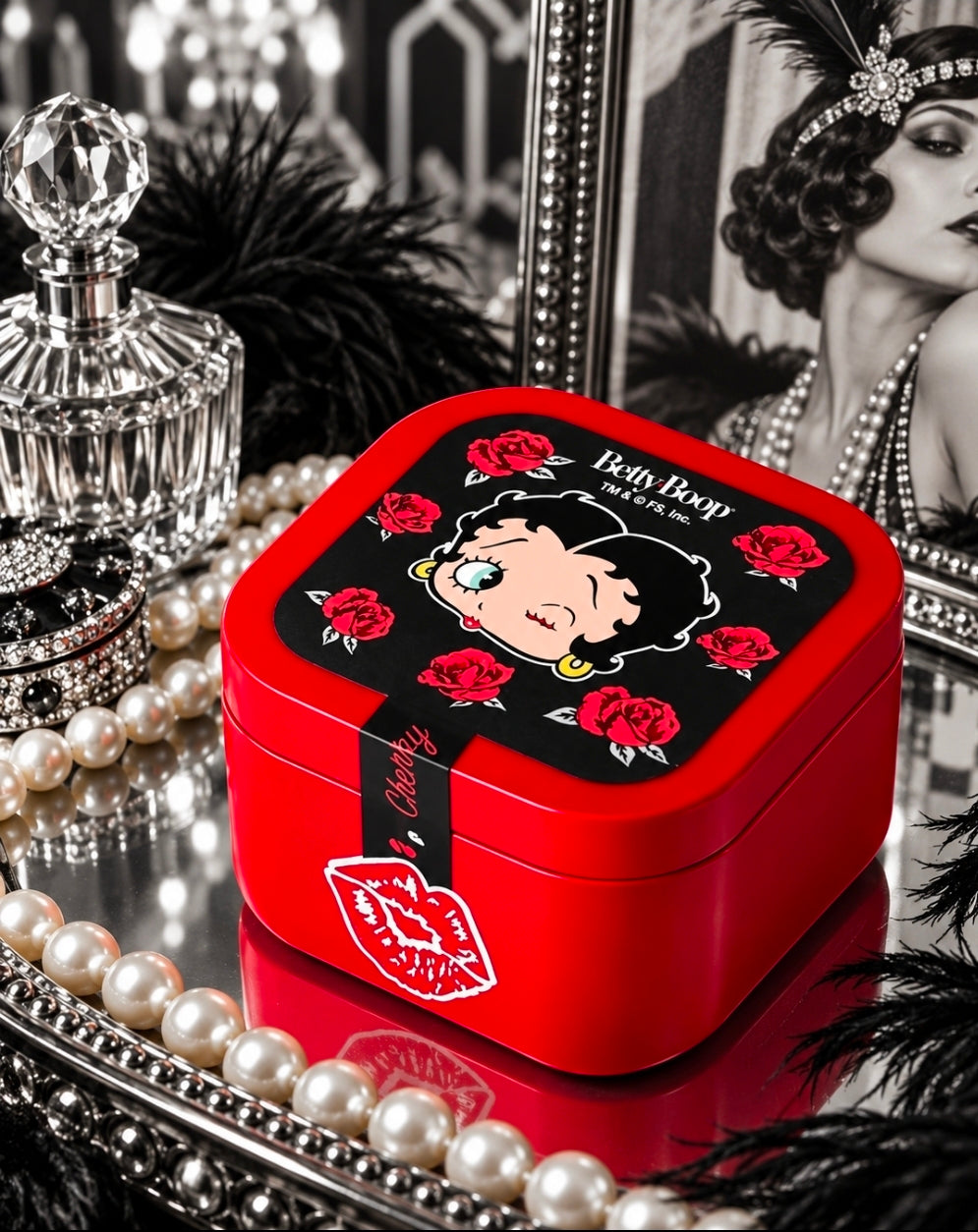 Red square tin candle with Betty Boop rose graphic on the lid