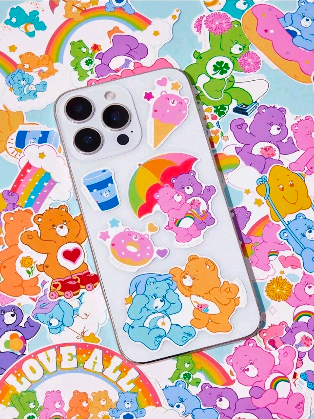 Vinyl bear decal stickers on a white phone case with rainbow and heart details
