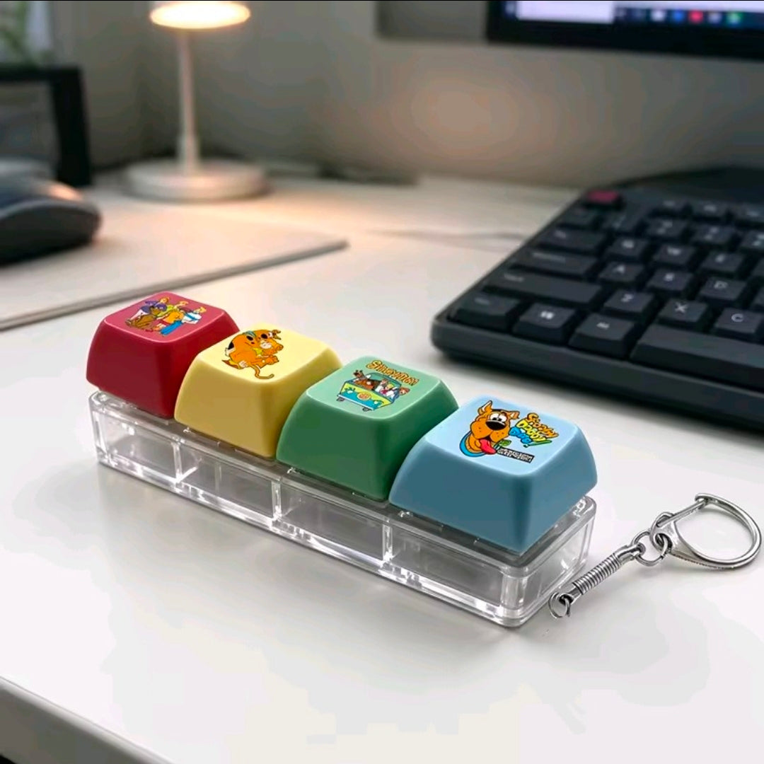 Four acrylic keycap fidgets with character-printed caps and metal keychain spring