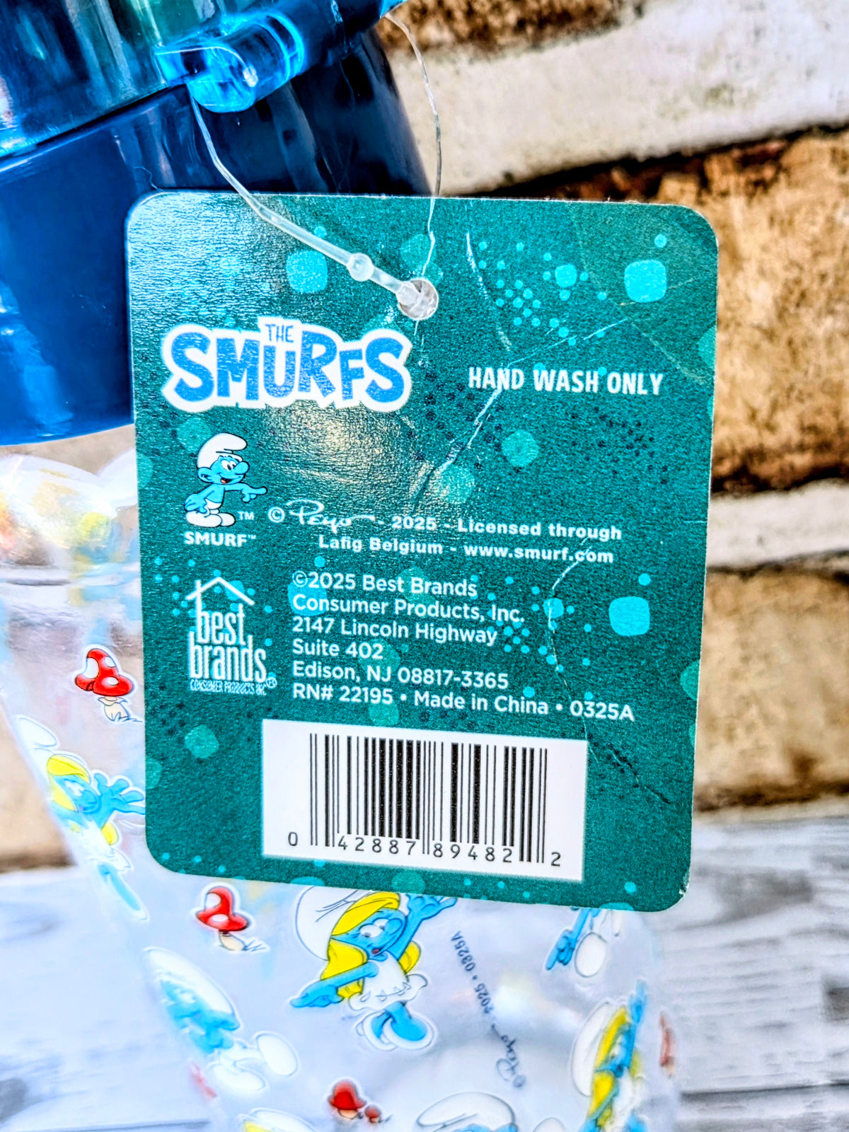 Smurfs self-care gift set info card, teal with hand wash only and barcode