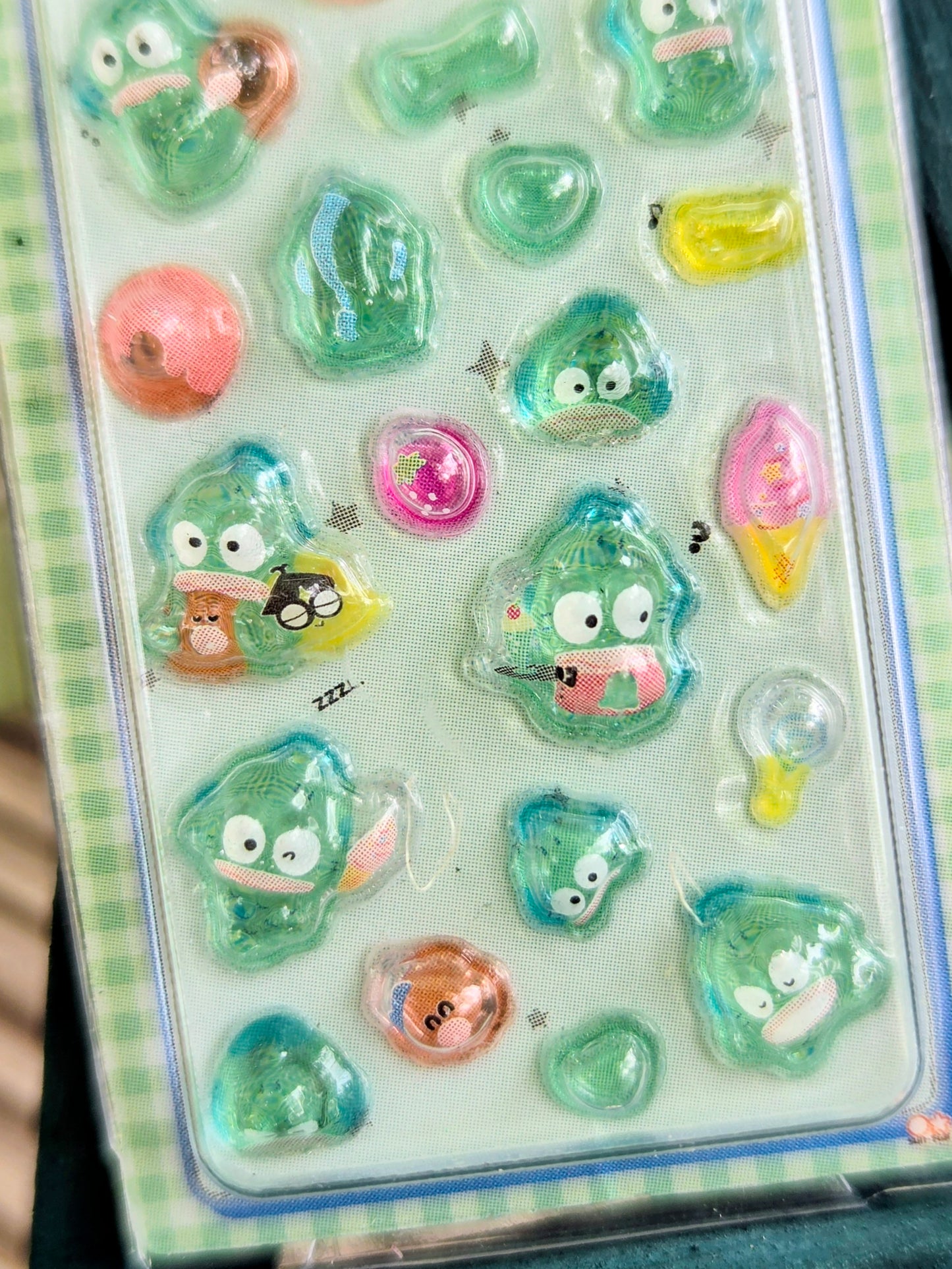 Green-themed 3D sticker set card with clear blister and assorted pastel charm pieces.