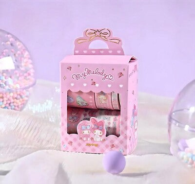 Washi tape set in a pink My Melody-themed display box, with rolls visible
