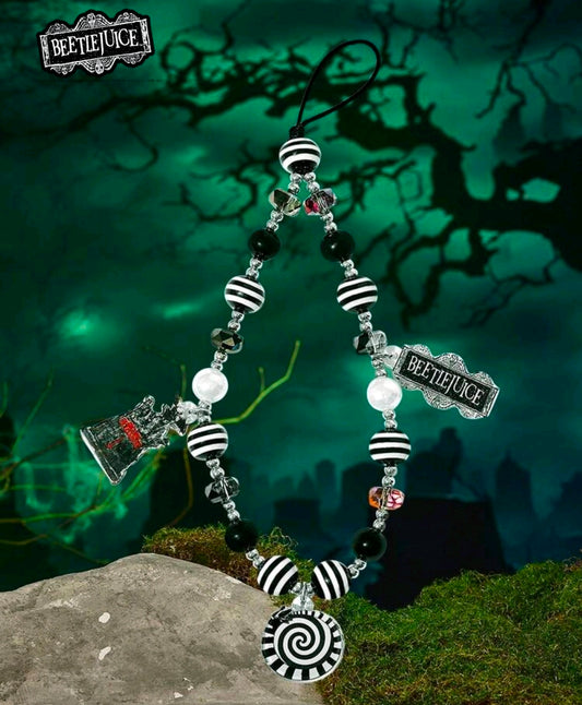 Beetlejuice beaded phone lanyard with black, white striped beads and spiral charm