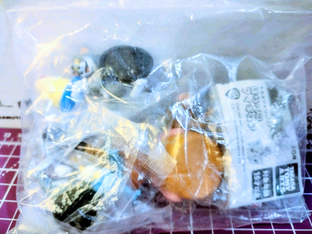 Sealed Tom and Jerry figure in clear plastic bag with printed product label