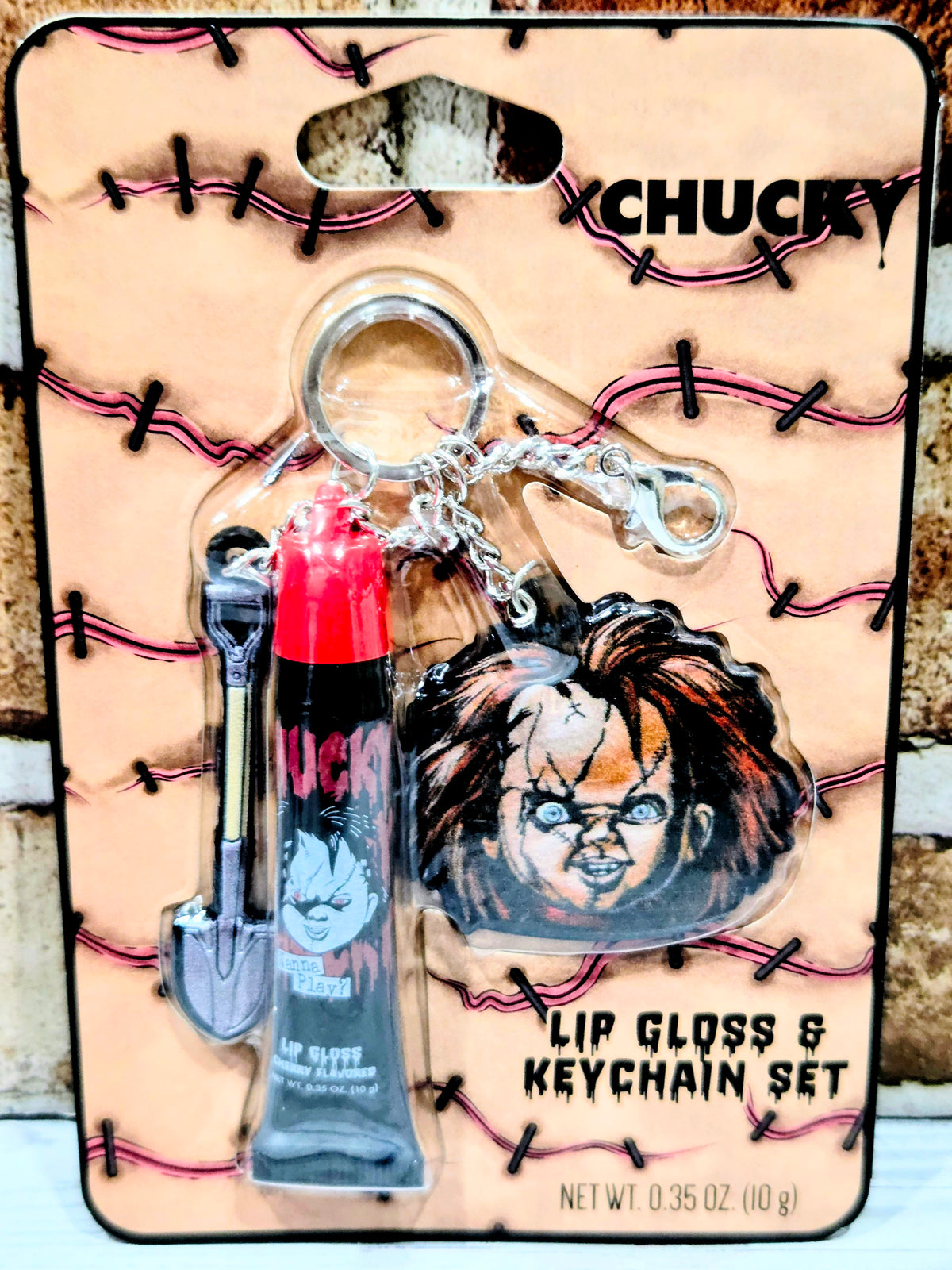 Chucky lip gloss and keychain set in blister pack with character face keychain
