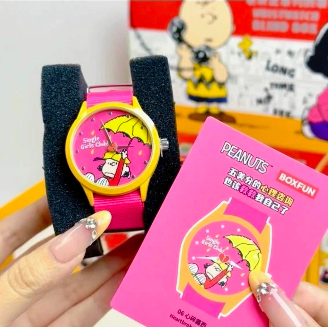 Girls Snoopy watch with pink strap and yellow case, shown with pink gift box