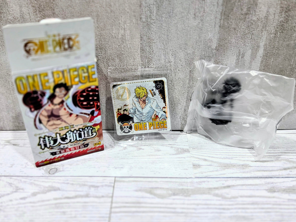 Sealed bag with small black collectible figure with One Piece character card and box