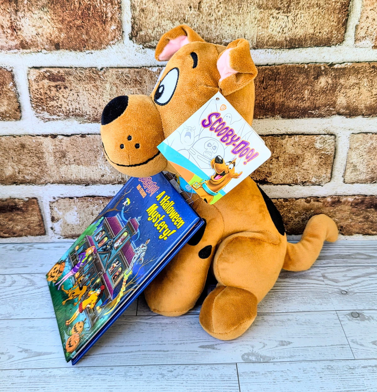 Scooby-Doo plush sitting with a Halloween mystery hardcover book
