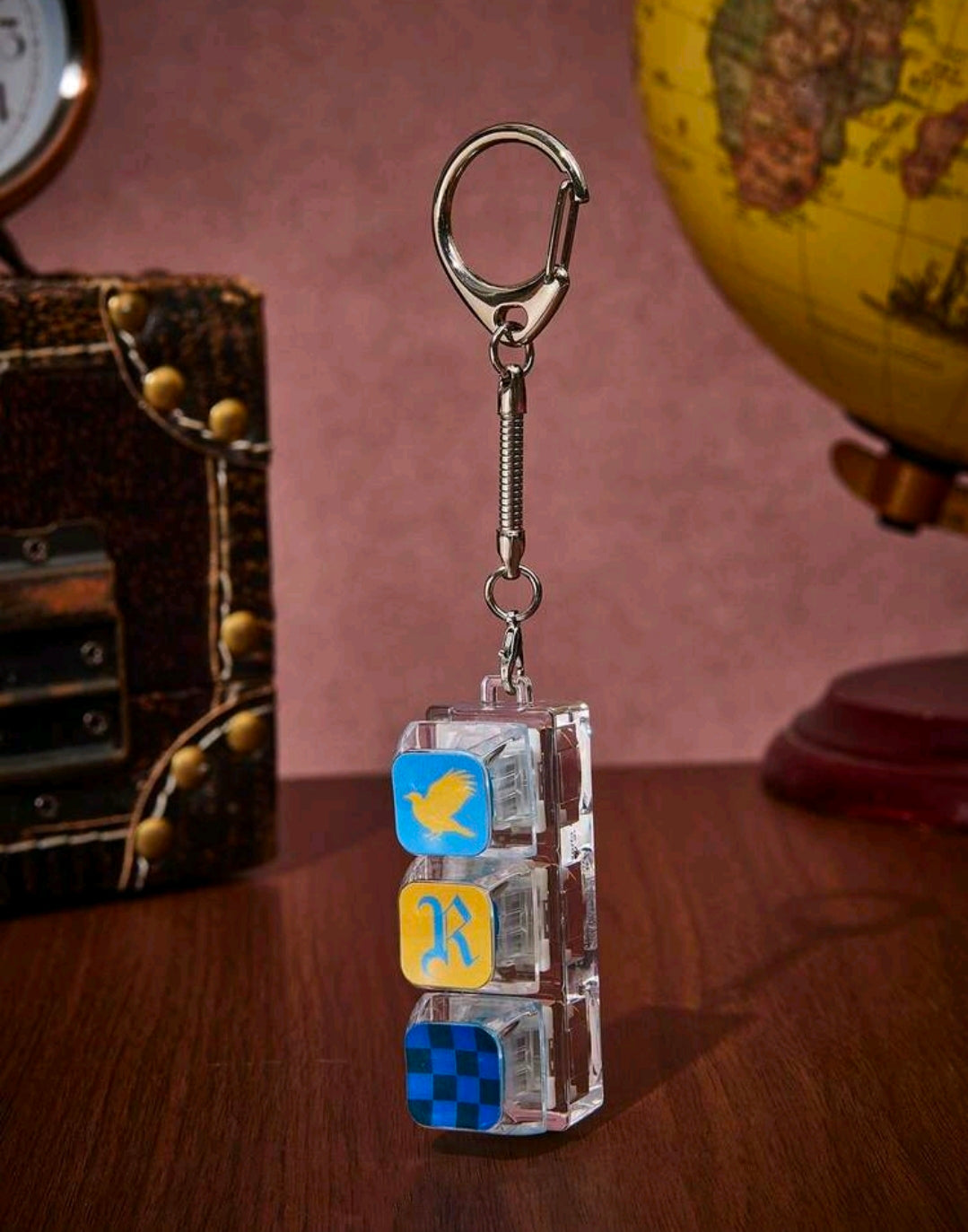 Ravenclaw bag charm keychain with silver chain and clear cube blocks showing bird and checkers
