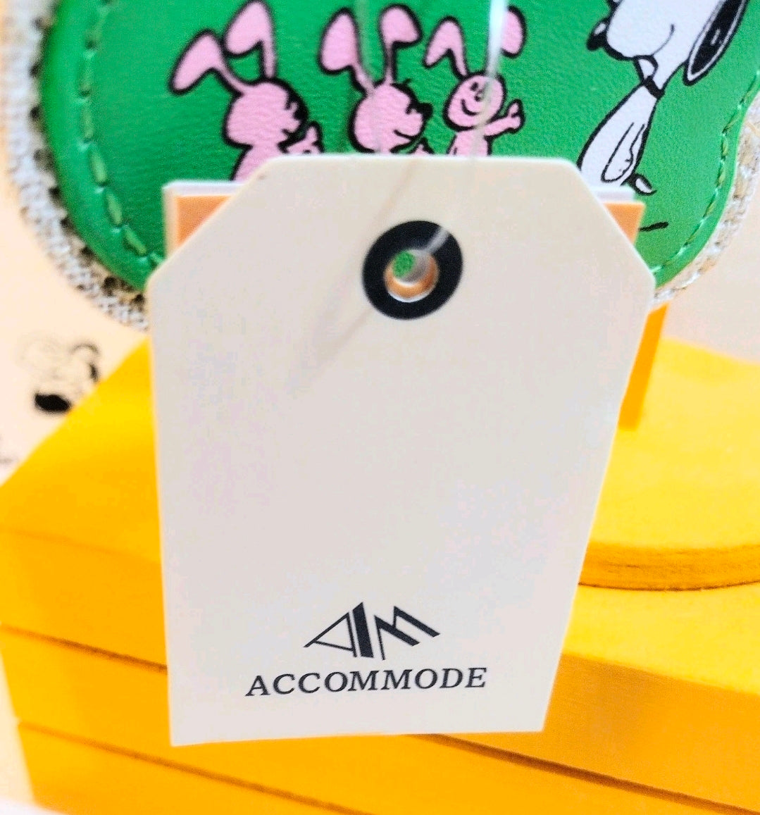 Close-up green Snoopy keychain patch with bunnies scene, gold hardware