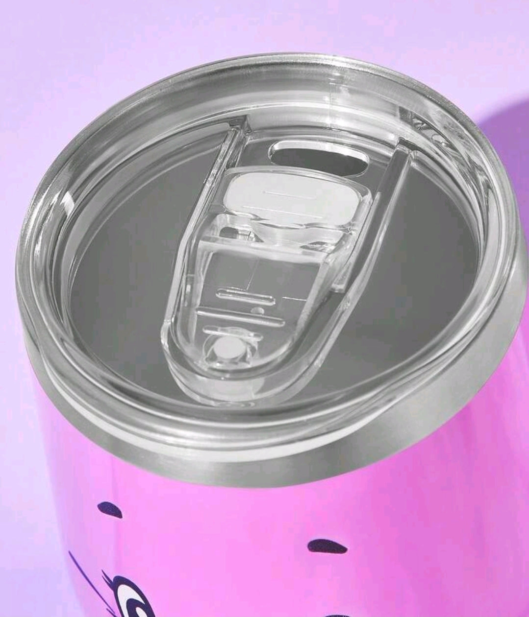 Pink insulated tumbler with open clear drinking spout under hinged lid
