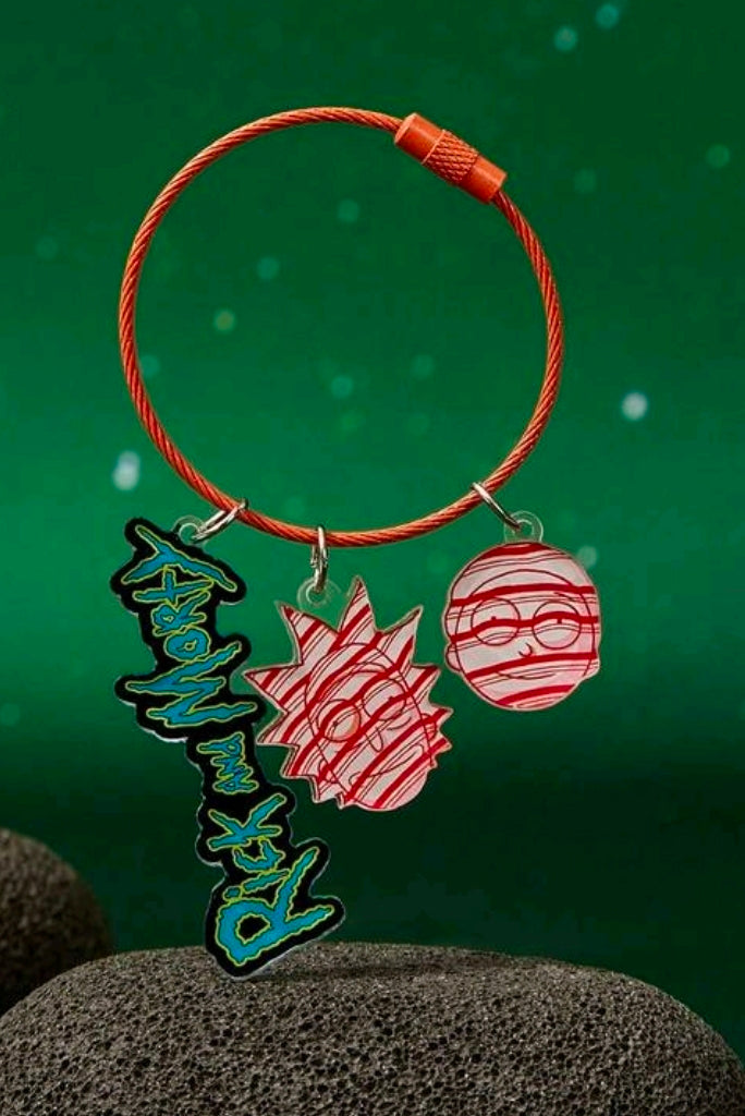 Braided orange wire keyring with blue name charm and two red acrylic charms on rings