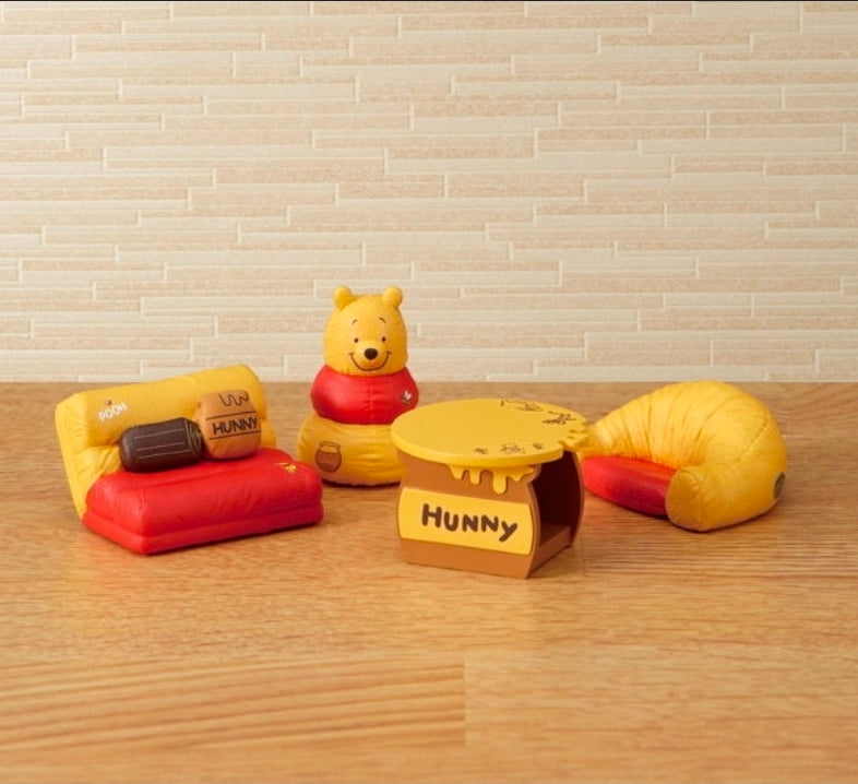 Mini Pooh/Hunny plush furniture set arranged on a wooden floor