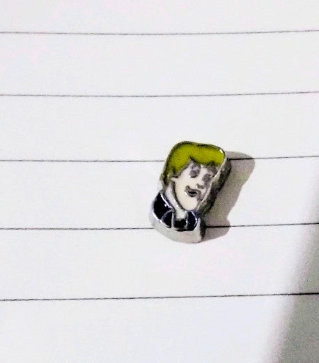 Character floating charm: light-haired figure with yellow-green hood on round silver base