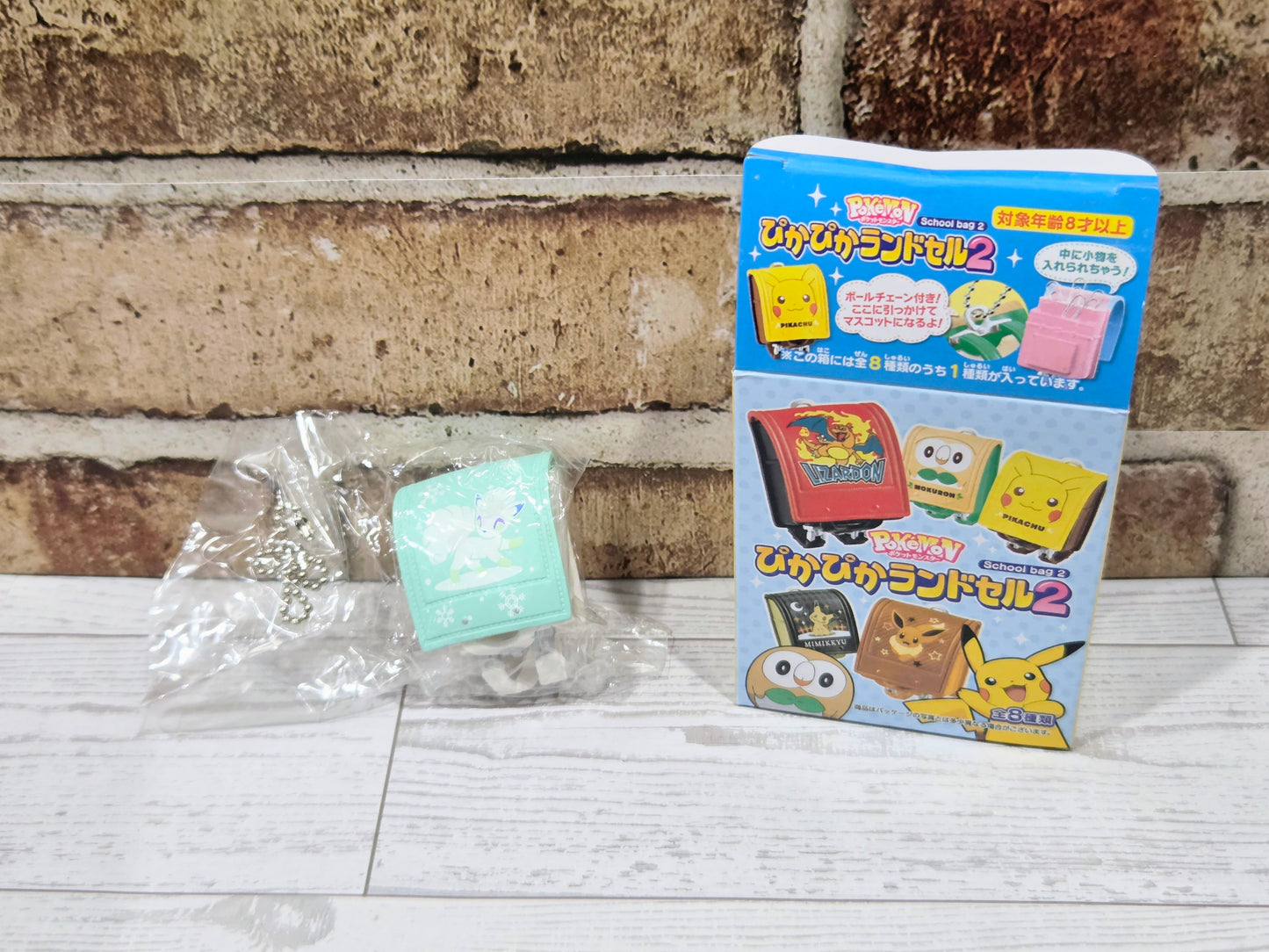 Mini school bag figure set in retail box on white tabletop