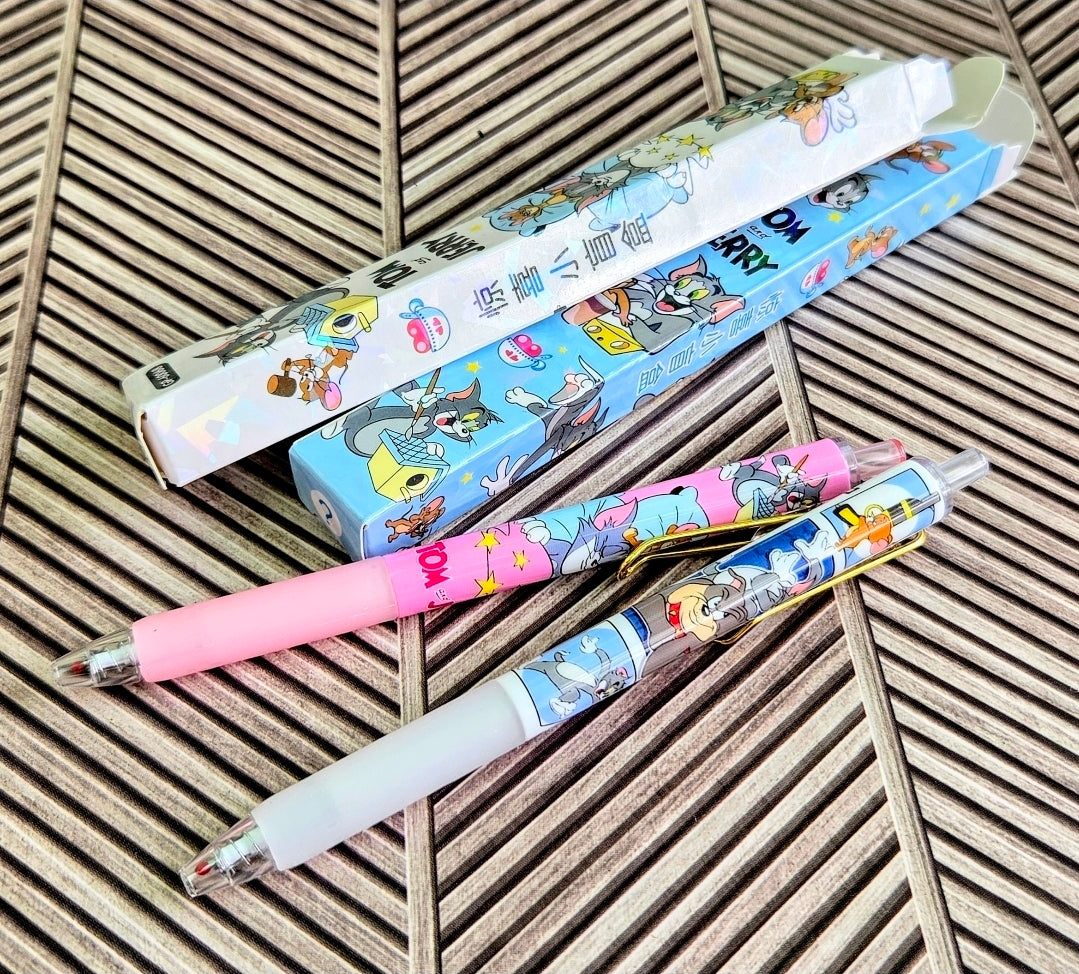 Pink and white Tom & Jerry gel pens with cartoon print barrels and clear tip