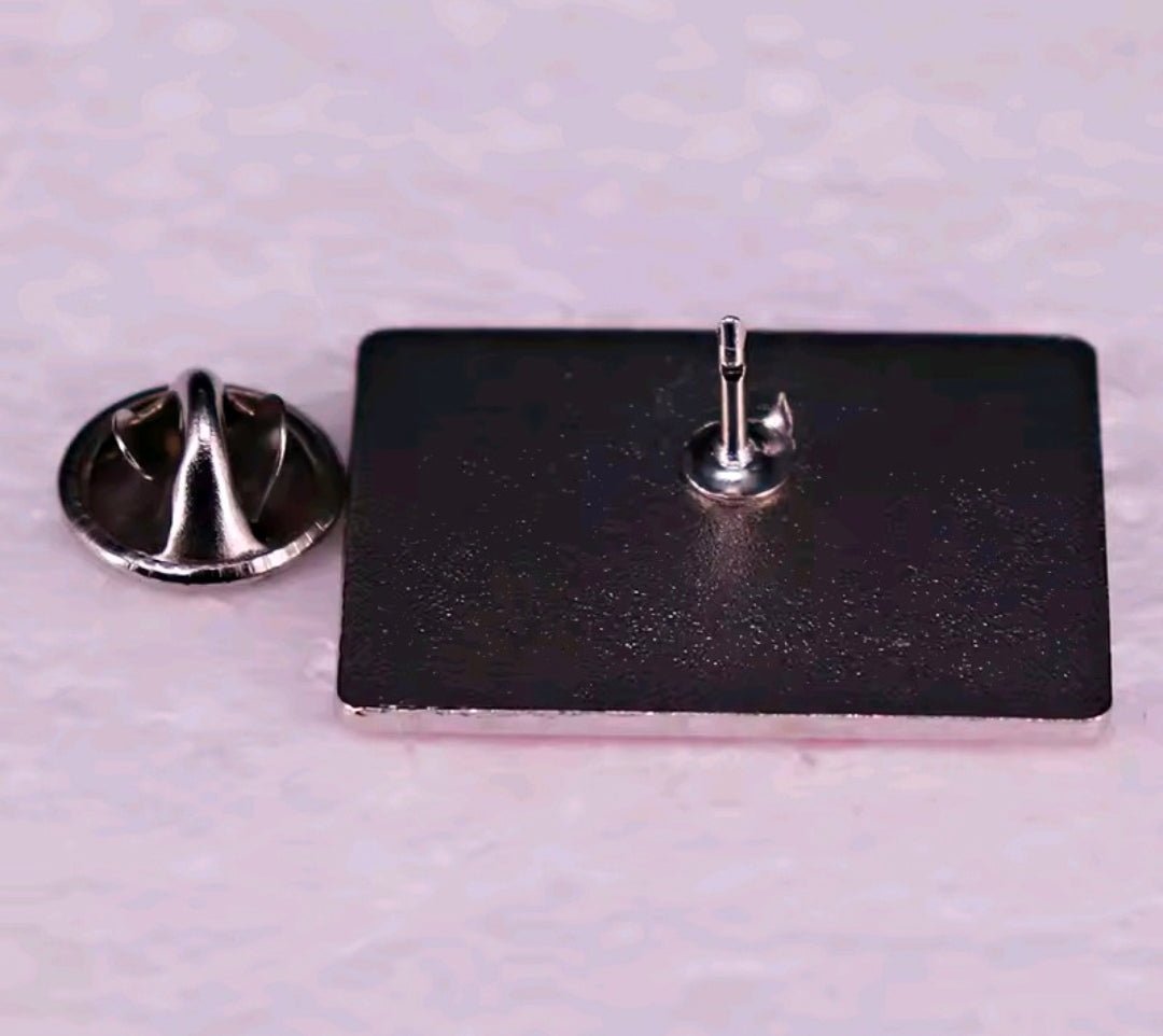 Back of retro TV enamel pin with black backing and silver pin post