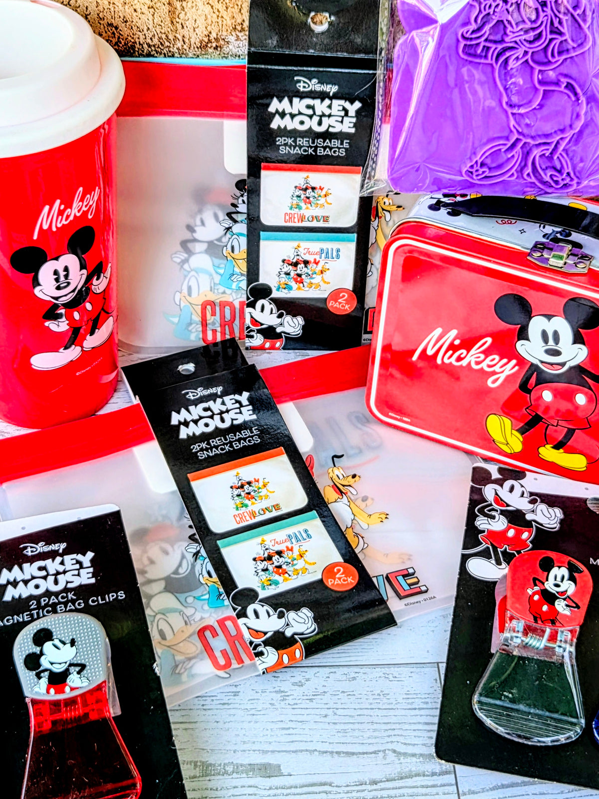 Mickey kitchen gift set items: reusable snack bags, magnetic bag clips, red cup, toast stamp